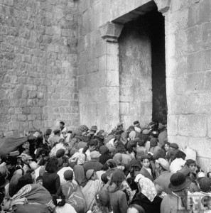 Expelled from their homes, Jewish refugees flee the old city through Zion's Gate.  Photo Credit: John Phillips, Time and Life Pictures/Getty Images